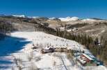 Nestled in a winter wonderland, this stunning property boasts a luxurious lodge-style home with breathtaking mountain views.
