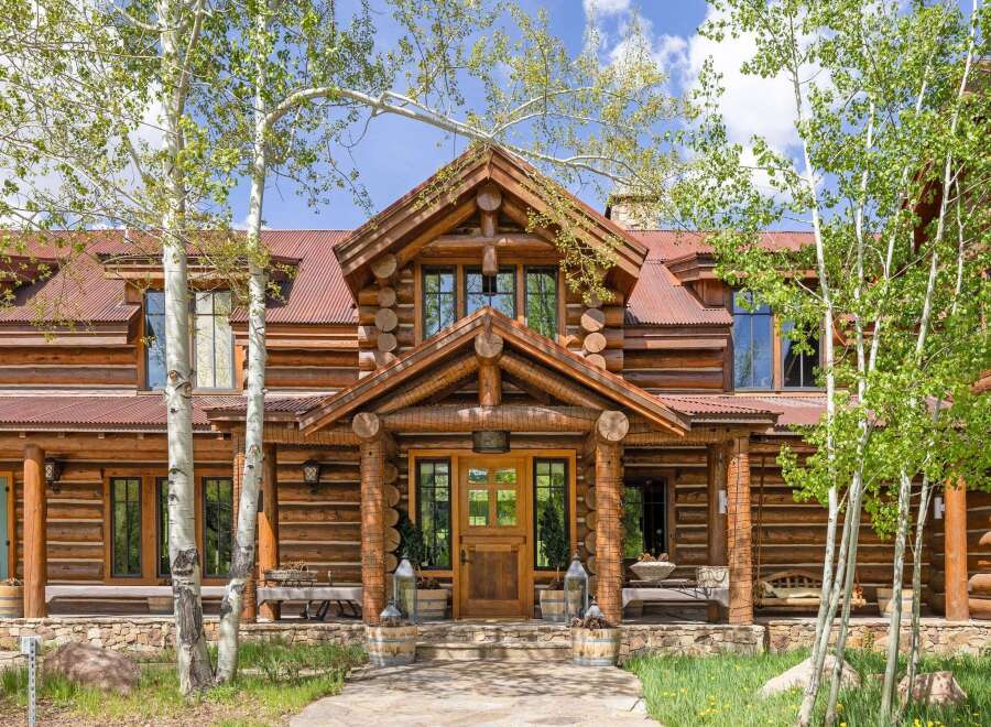 This stunning log cabin home offers a perfect blend of rustic charm and modern luxury.