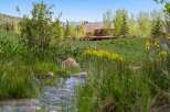 Nestled in a serene natural setting, this stunning property offers a perfect blend of luxury and tranquility.