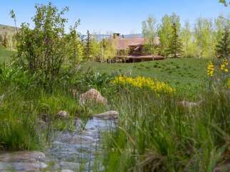 Nestled in a serene natural setting, this stunning property offers a perfect blend of luxury and tranquility.