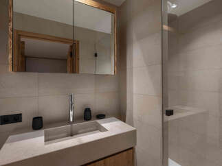 Step into modern luxury with this stunning bathroom design.