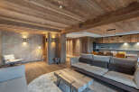 Experience rustic elegance in this stunning property, featuring a warm, inviting interior with exposed wooden beams and paneling.