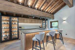 This stunning kitchen showcases a rustic yet modern design, perfect for a luxurious home.
