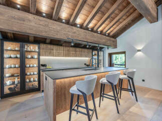 This stunning kitchen showcases a rustic yet modern design, perfect for a luxurious home.