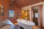 This luxurious bathroom features a stunning clawfoot tub, perfect for a relaxing soak.