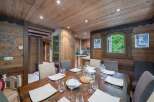 Step into a cozy dining room with rustic charm, perfect for intimate gatherings.