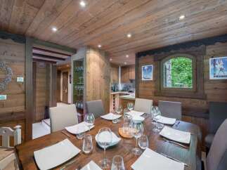 Step into a cozy dining room with rustic charm, perfect for intimate gatherings.