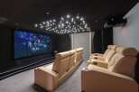 Experience the ultimate home theater with this luxurious setup.