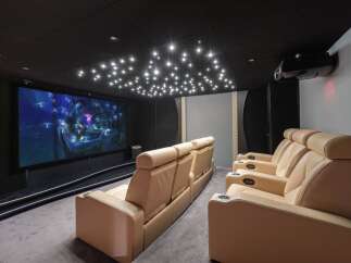 Experience the ultimate home theater with this luxurious setup.