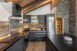 Experience the epitome of rustic elegance in this stunning kitchen.