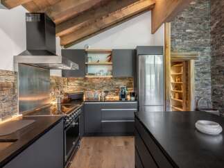 Experience the epitome of rustic elegance in this stunning kitchen.