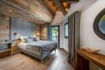Experience rustic elegance in this stunning bedroom.