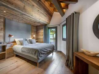 Experience rustic elegance in this stunning bedroom.