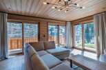 Experience luxury living in this stunning property, featuring a spacious living area with floor-to-ceiling windows that offer breathtaking views.