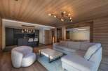 This stunning living space showcases a modern design with a touch of rustic charm.