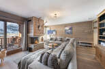 Experience the epitome of luxury living in this stunning chalet, boasting a cozy fireplace and breathtaking mountain views.