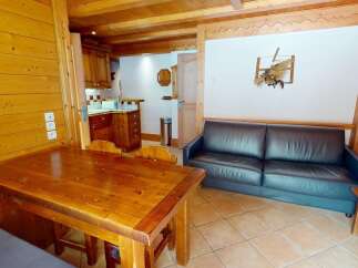 Discover the charm of this cozy property, featuring a rustic wooden interior and a welcoming atmosphere.