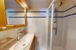 This charming bathroom features a bright and airy design, perfect for starting your day.