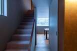 This stunning property features a modern staircase leading to the upper levels.