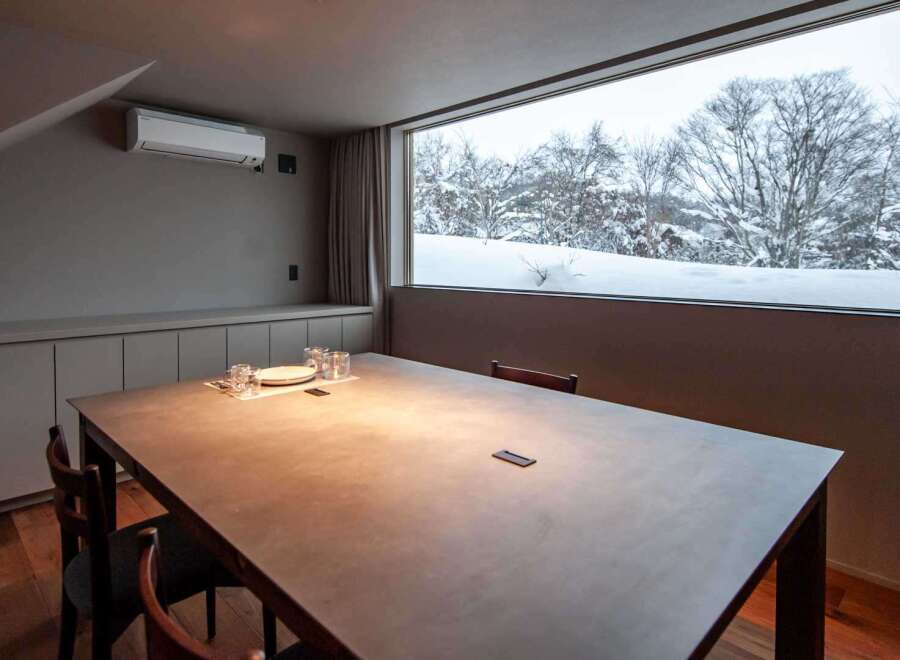 Experience the tranquility of this stunning property with a breathtaking view of a snow-covered landscape.