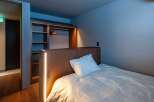Experience modern comfort in this stylish bedroom.