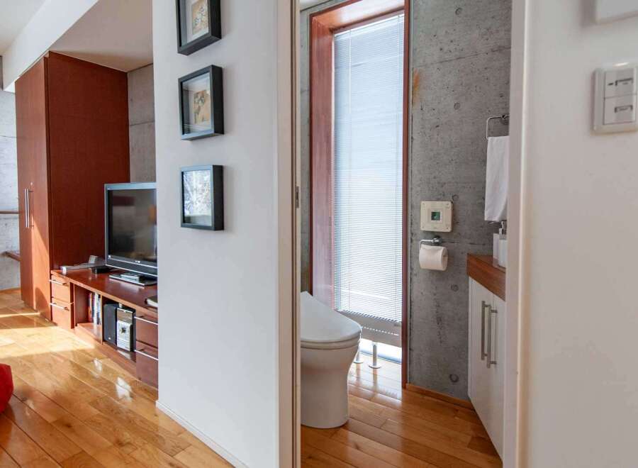 This modern apartment showcases a stylish interior with a focus on natural light and contemporary design.