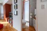 This modern apartment showcases a stylish interior with a focus on natural light and contemporary design.