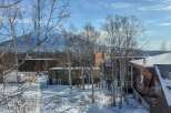 This stunning property offers breathtaking views of the snow-capped mountains, creating a serene and picturesque setting.