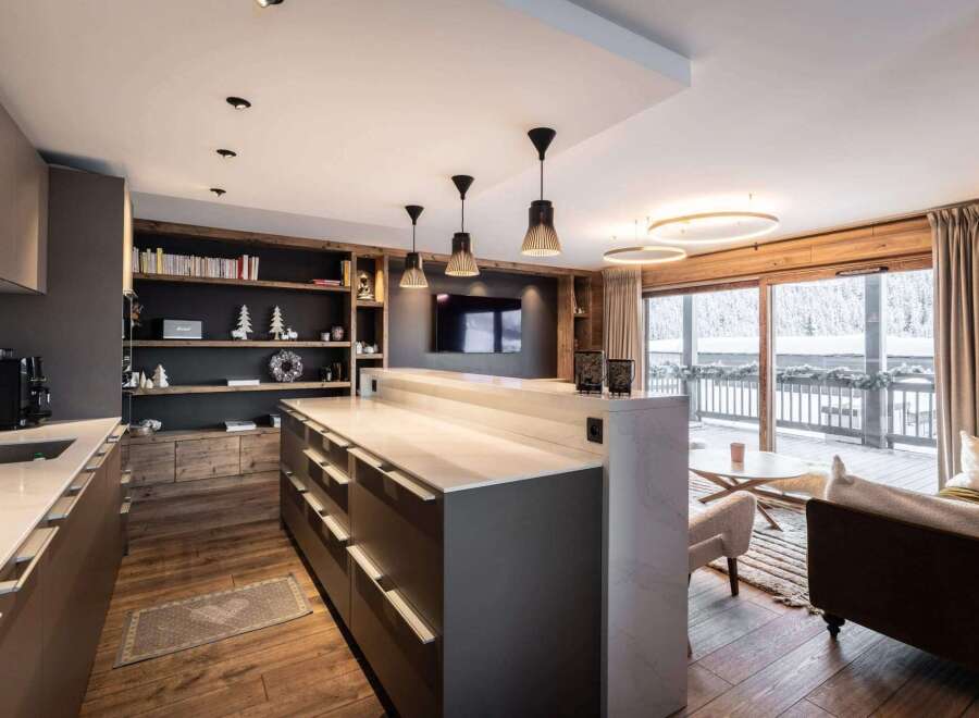 Experience luxury living in this stunning property, featuring a modern kitchen with sleek countertops and ample storage.