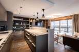 Experience luxury living in this stunning property, featuring a modern kitchen with sleek countertops and ample storage.
