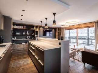 Experience luxury living in this stunning property, featuring a modern kitchen with sleek countertops and ample storage.