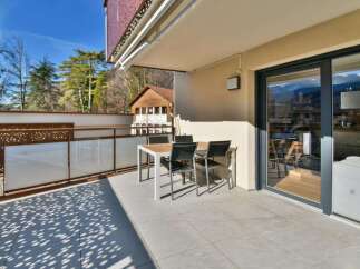 Enjoy breathtaking views from this stunning balcony! This property features a modern outdoor dining set, perfect for entertaining or relaxing.