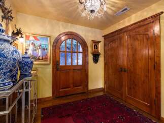 Step into luxury with this stunning entryway, showcasing exquisite craftsmanship and timeless elegance.