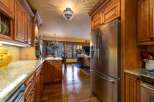 Step into luxury with this stunning kitchen! Featuring custom wood cabinetry, granite countertops, and stainless steel appliances, this space is perfect for both cooking and entertaining.