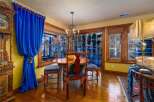 Step into this charming dining room, featuring a round table and elegant chairs, perfect for intimate gatherings.
