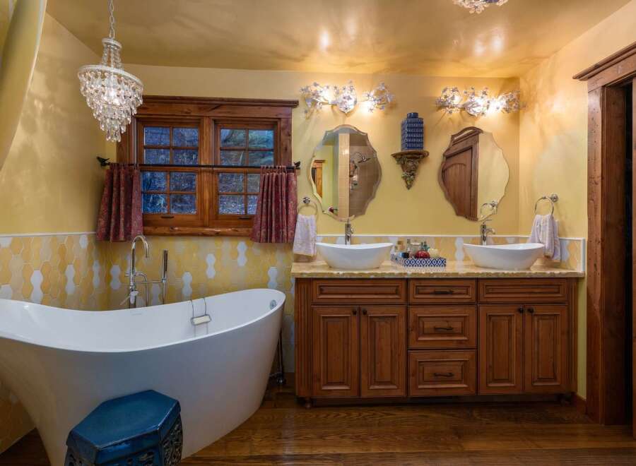 Step into luxury with this stunning bathroom featuring a freestanding tub and dual vanities.