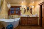 Step into luxury with this stunning bathroom featuring a freestanding tub and dual vanities.