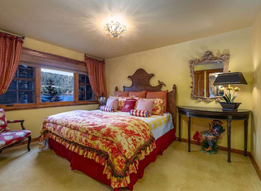 This charming bedroom offers a cozy retreat with its warm color palette and inviting decor.