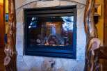 This stunning property features a cozy fireplace, perfect for those chilly evenings.