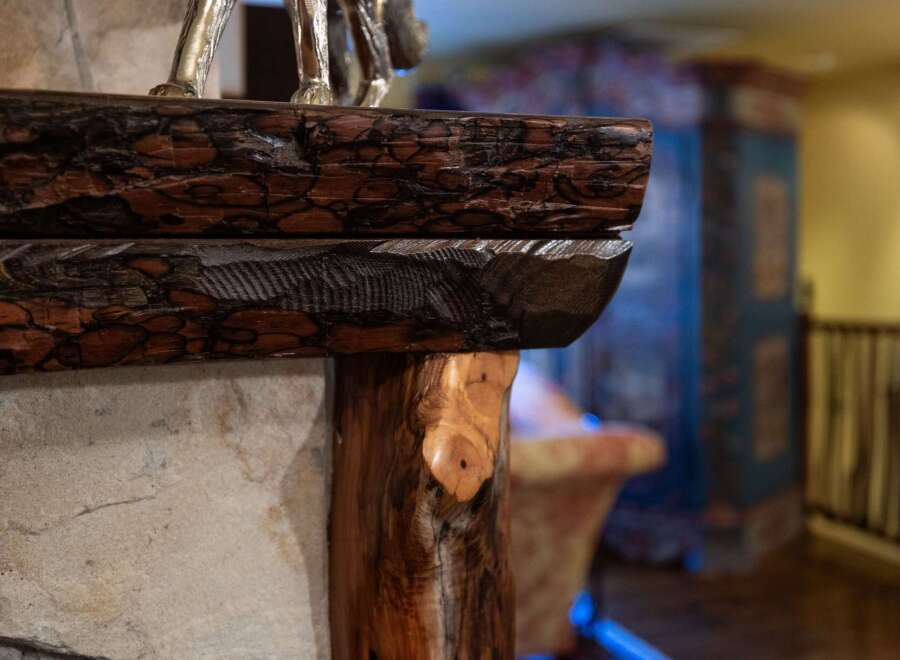 This stunning property boasts a unique rustic fireplace, perfect for cozy evenings.
