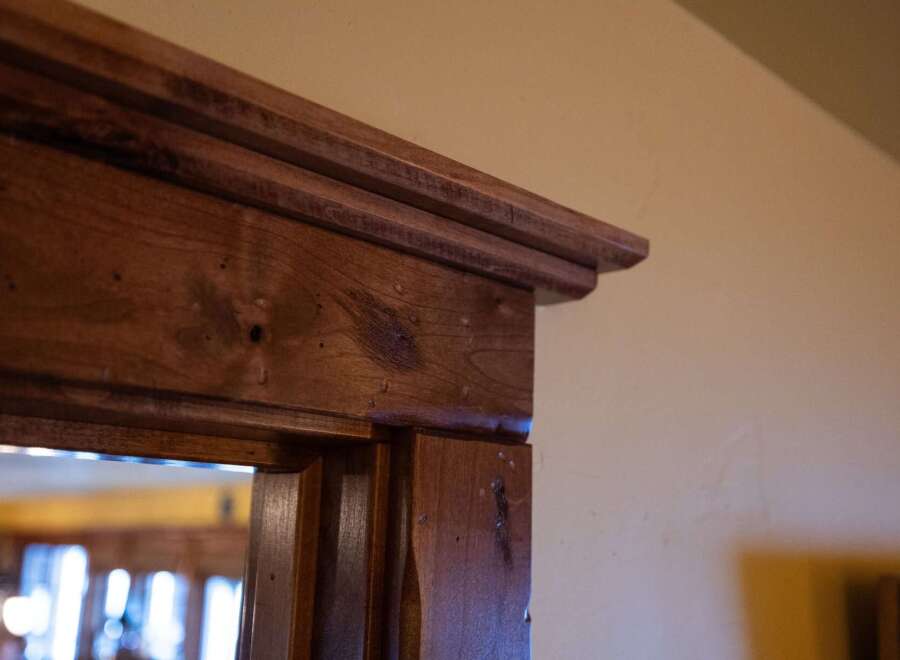 Showcasing exquisite craftsmanship, this property boasts stunning wooden trim details that add a touch of elegance.