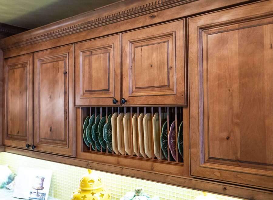 Showcasing a beautifully crafted kitchen with custom cabinetry, this space exudes warmth and elegance.