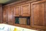 Showcasing a beautifully crafted kitchen with custom cabinetry, this space exudes warmth and elegance.