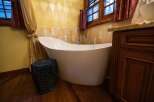 Indulge in luxury with this stunning bathroom featuring a modern freestanding tub.