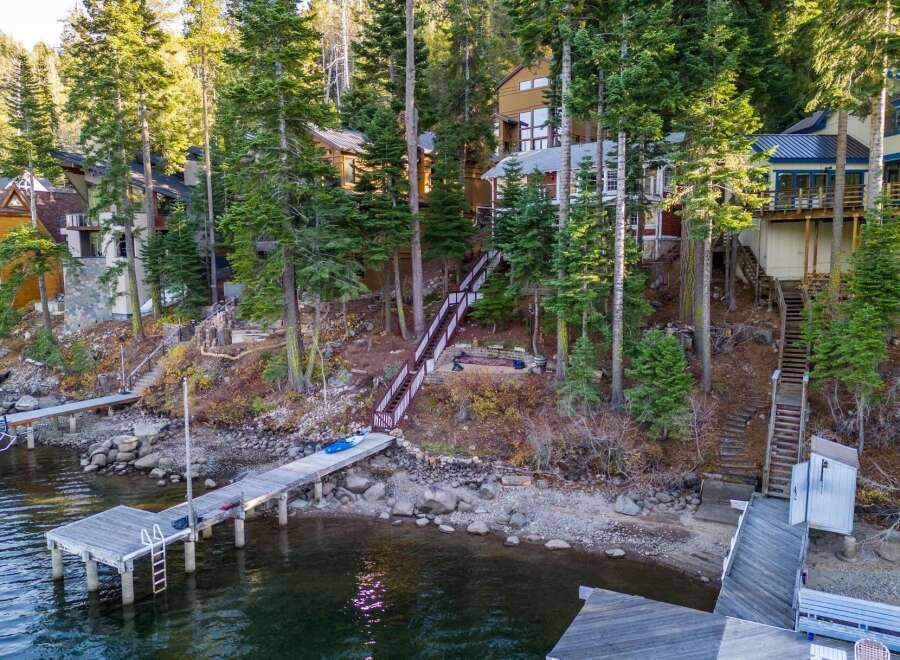 Nestled along the serene waterfront, this stunning property offers an idyllic retreat with direct lake access.