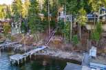 Nestled along the serene waterfront, this stunning property offers an idyllic retreat with direct lake access.