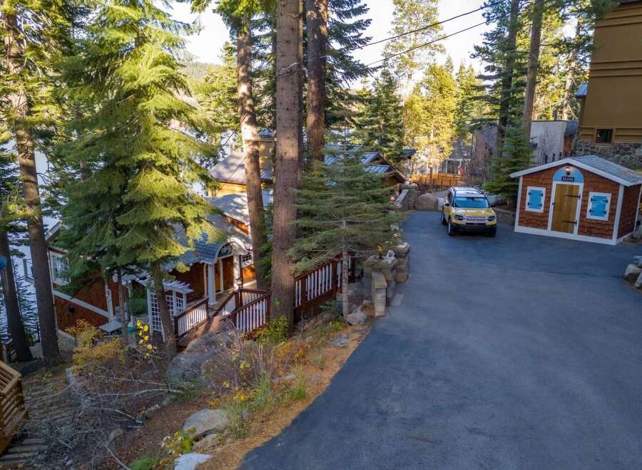 Nestled amidst towering trees, this charming property offers a serene escape.