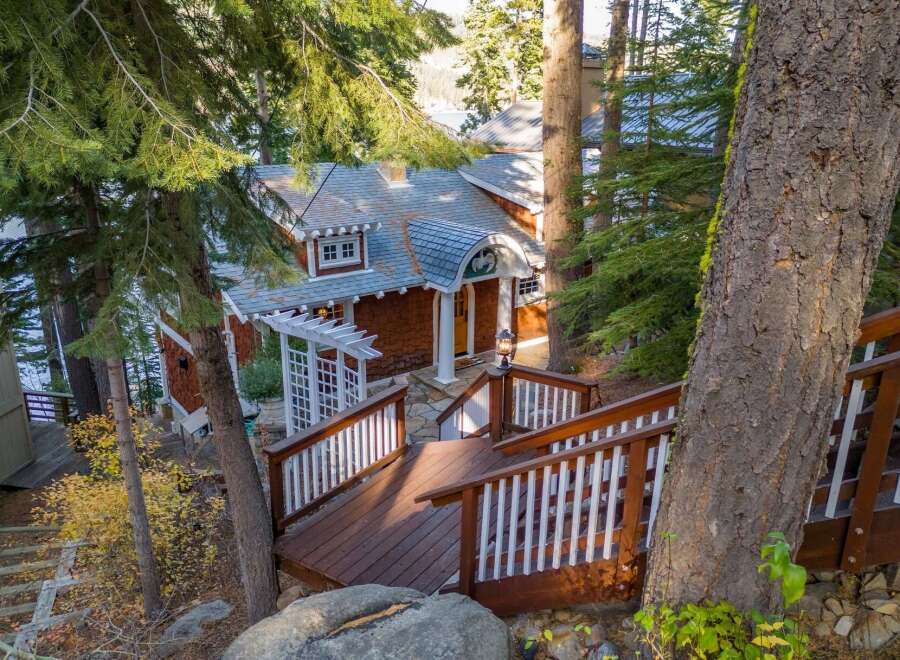 Nestled amidst lush greenery, this charming property boasts a rustic facade and inviting ambiance.
