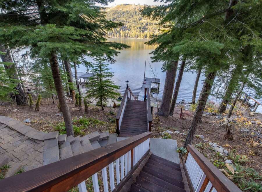 Escape to your lakeside retreat! This stunning property boasts a private dock, perfect for boating and enjoying the serene waters.