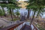 Escape to your lakeside retreat! This stunning property boasts a private dock, perfect for boating and enjoying the serene waters.